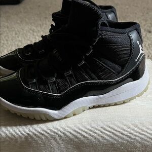 Jordan 11 Kids Black and White High-Top Sneakers